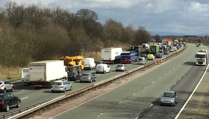 M56 incident “resolved” after man talked down from bridge - Warrington ...